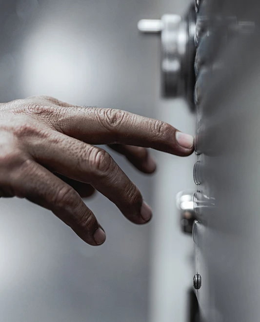 Hand touching machine interface screen to start milling process